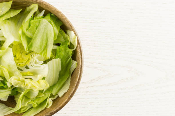 istock Fresh Raw Iceberg Lettuce on grey wood 955116924