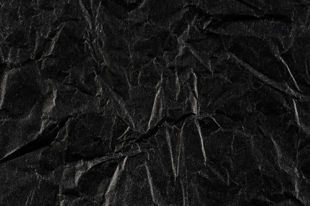 istock abstract background with black wrinkled paper 955117064