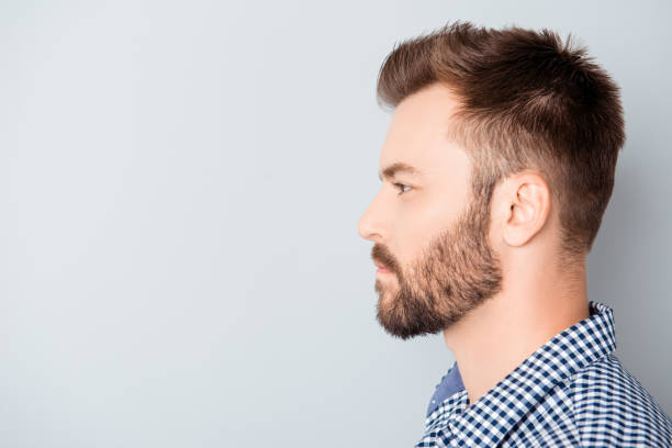 istock Side view of young bearded man isolated on gray background 955120522