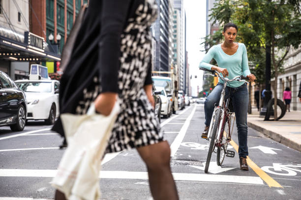 istock Woman cycling - commuter in downtown Chicago 955120634