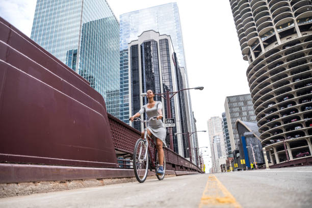 Woman cycling - commuter in downtown Chicago