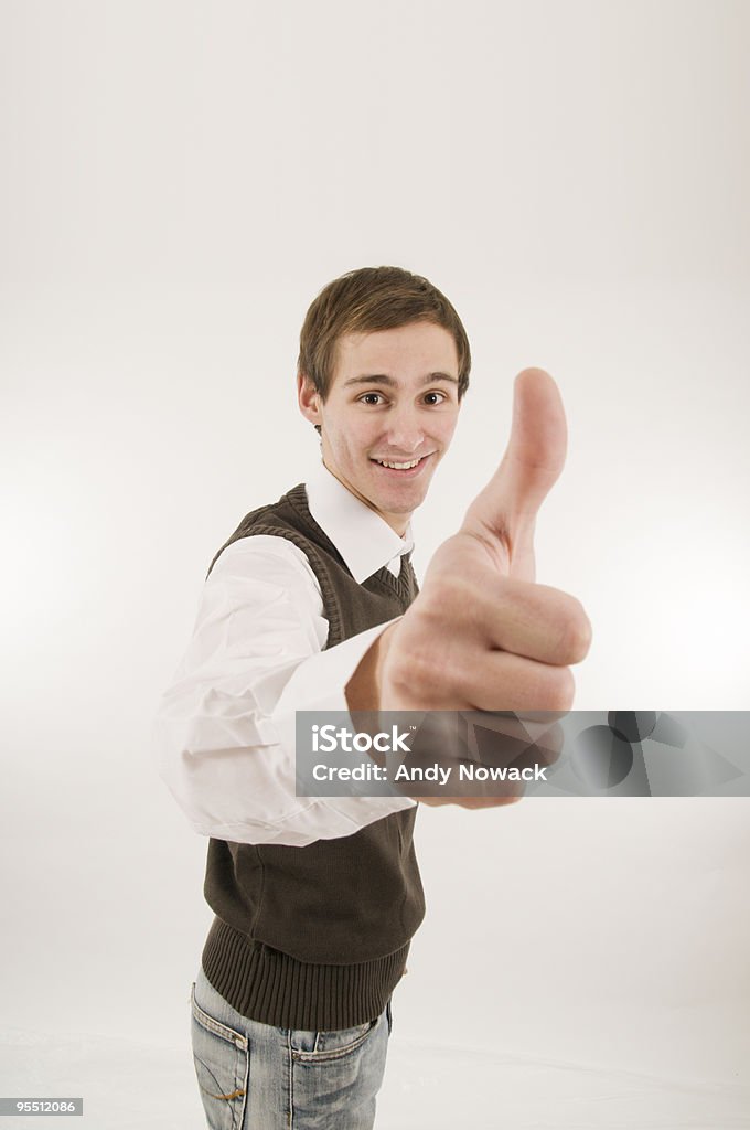 man gesturing thumbs up wide young man with white shirt show the thumbs up; wide angle 20-29 Years Stock Photo