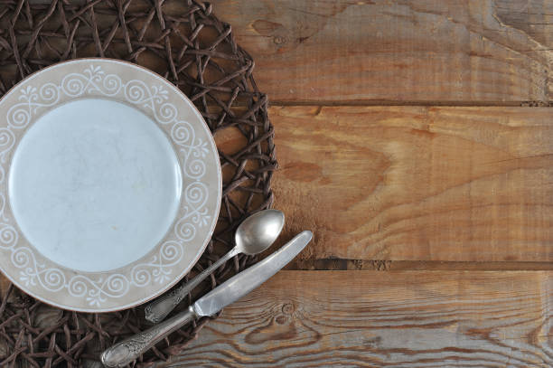 istock blank template for food composition - plate, knife and spoon 955123558