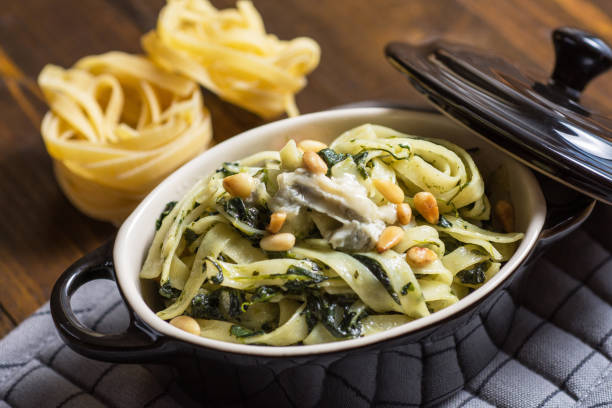 istock Spaghetti with Spinach, Pine Nuts and Gorgonzola Cheese 955124154