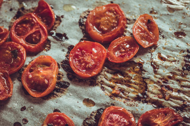 istock Roasted Cherry Tomatoes with Salt, Black Sesame and Olive Oil. Rustic Style. 955128458