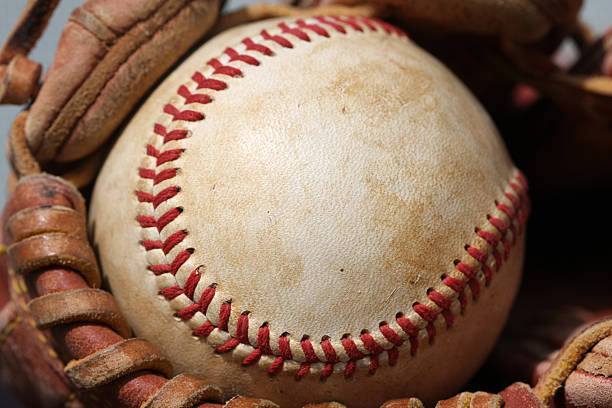 istock Baseball close up in a Glove 95512902