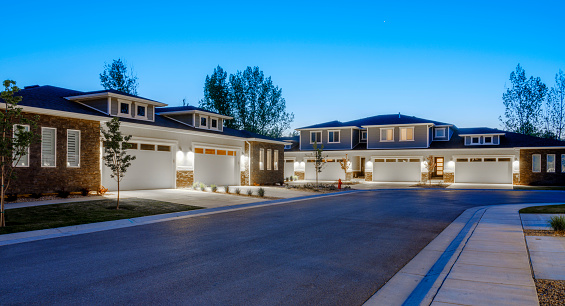 A suburban USA neighborhood at dusk.