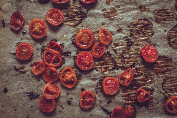 istock Roasted Cherry Tomatoes with Salt, Black Sesame and Olive Oil. Rustic Style. 955131236