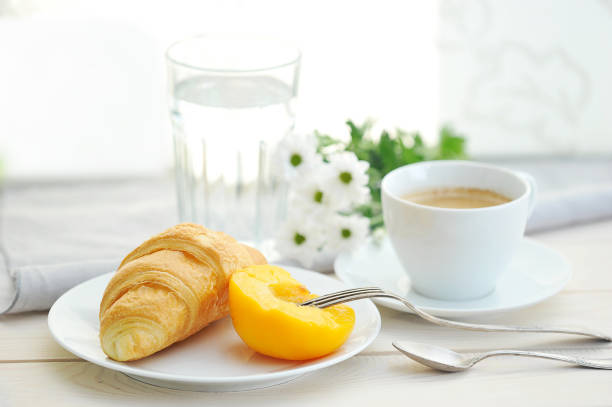 istock Sunny morning with Breakfast, coffee, croissant 955131270