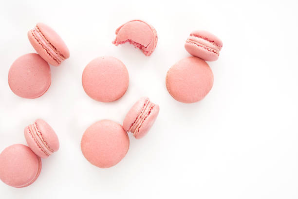 istock Classic french pink macarons on white background. Isolated 955131348