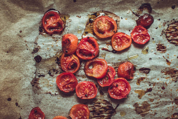 istock Roasted Cherry Tomatoes with Salt, Black Sesame and Olive Oil. Rustic Style. 955131742