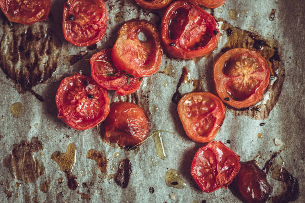istock Roasted Cherry Tomatoes with Salt, Black Sesame and Olive Oil. Rustic Style. 955132492