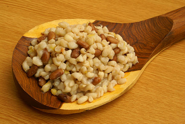 Samp with beans on the wooden spoon stock photo