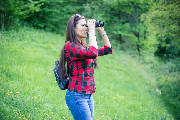 istock Young woman exploring nature. 955135850