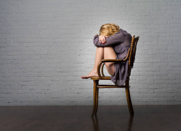 istock A young woman and a chair. 955136168