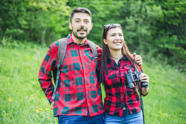 istock Man and woman exploring nature. 955136510