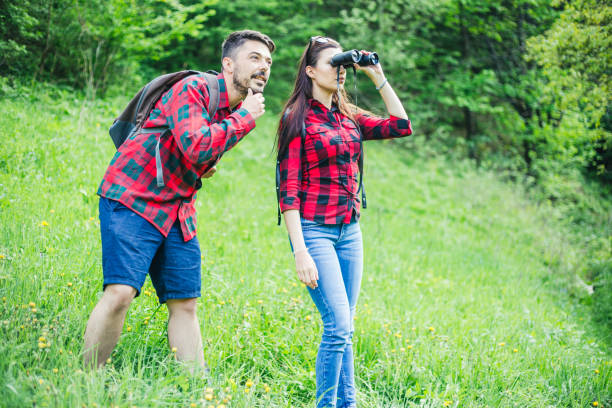 istock Man and woman exploring nature. 955136558
