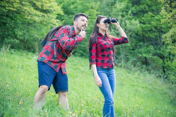 Man and woman exploring nature.