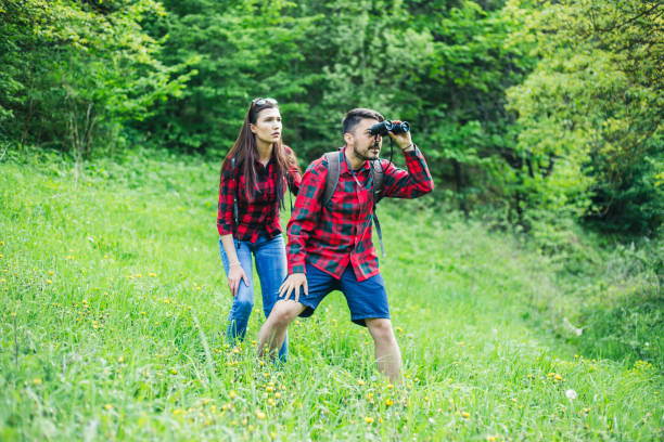 istock Man and woman exploring nature. 955136624