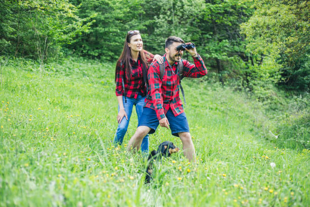 istock Man and woman exploring nature. 955136680