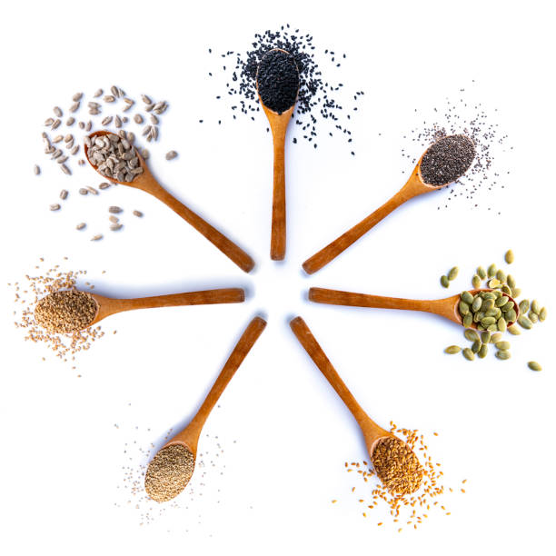 composition of spoons with seeds on white background - quinoa sesame chia flax seed imagens e fotografias de stock