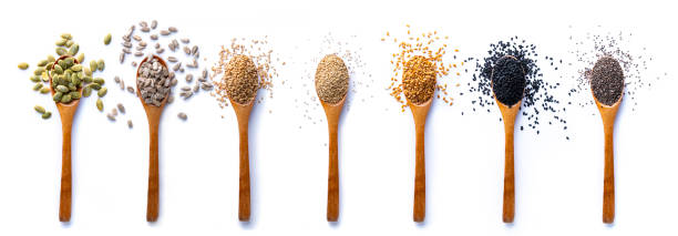 set of spoons with different seeds on white background - quinoa sesame chia flax seed imagens e fotografias de stock