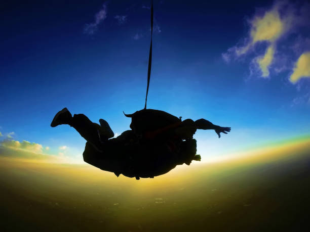 istock Skydiving tandem at the sunset 955139714