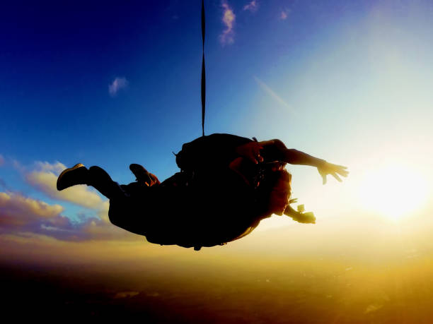 Skydiving tandem at the sunset