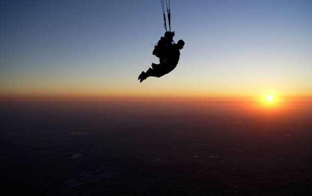 istock Skydiving tandem at the sunset 955139966
