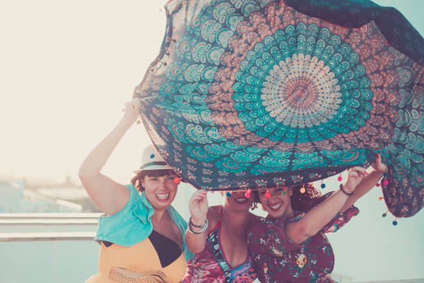 istock three caucasian woman in summer time activities 955140236
