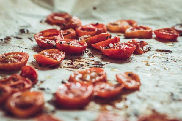 istock Roasted Cherry Tomatoes with Salt, Black Sesame and Olive Oil. Rustic Style. 955143950