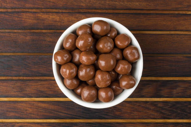 istock Chocolate Balls on wooden background 955149938