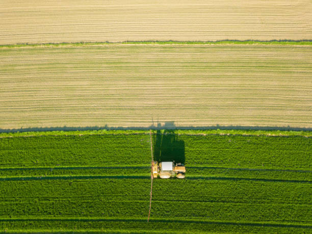 istock Aerial view of tractor on a field 955152976