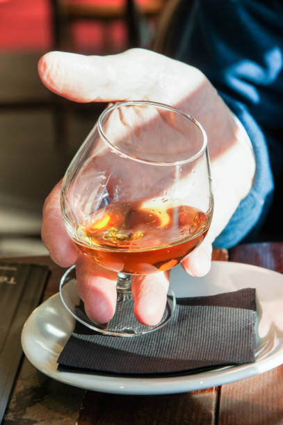 istock A glass of wine in his hand. 955156460
