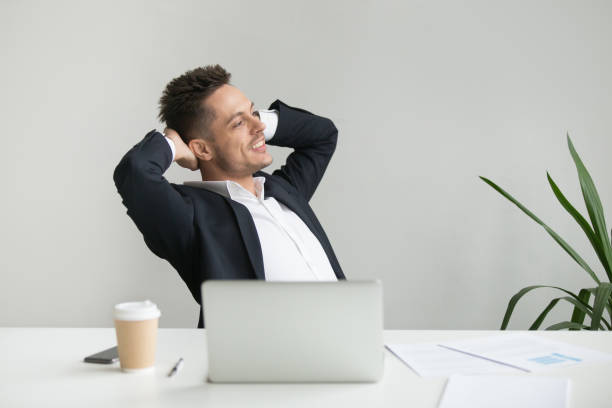 istock Satisfied CEO leaning back in chair happy with good results 955158554