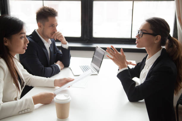 confident applicant being judged by interviewing hr managers - thinking professional occupation unemployment job search imagens e fotografias de stock