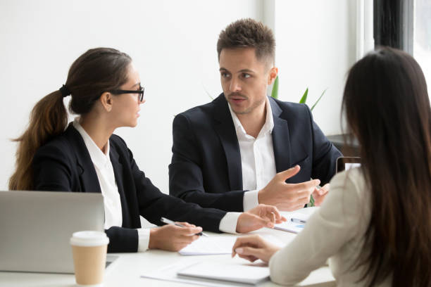 istock Colleagues discussing business strategy in office 955158664