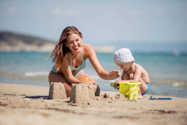 istock Family having fun on the beach 955162612