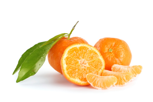 Fresh orange mandarines, pieces, leaves and cross section against white background
