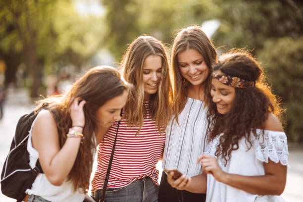 istock teens friends using the smartphone in the city 955170146