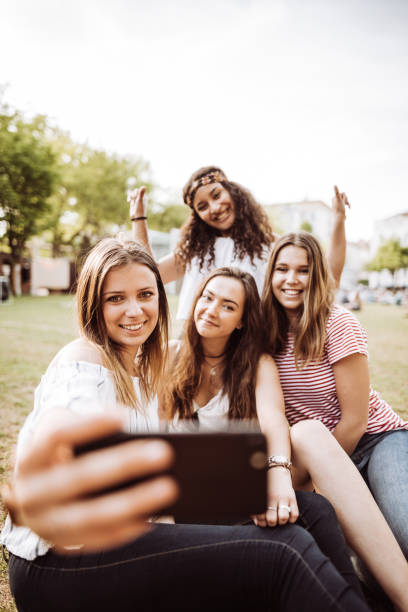 istock friends take a selfie in the park 955170232