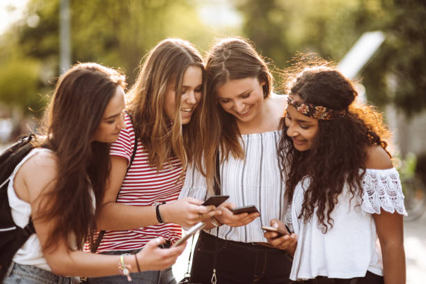 istock teens friends using the smartphone in the city 955170278