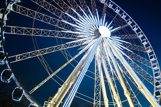 istock Large Ferris Wheel lit up at night, isolated 95517054