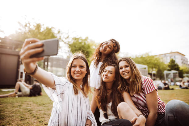 istock friends take a selfie in the park 955172438