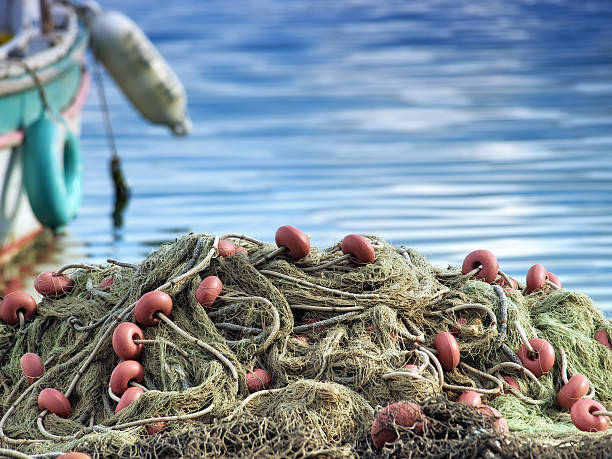 istock A mass of fishing nets by a boat 95518008
