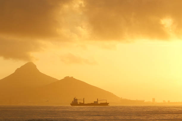 Sunset sunrise oceanic ship harbour harbor mountain cloudscape water sail