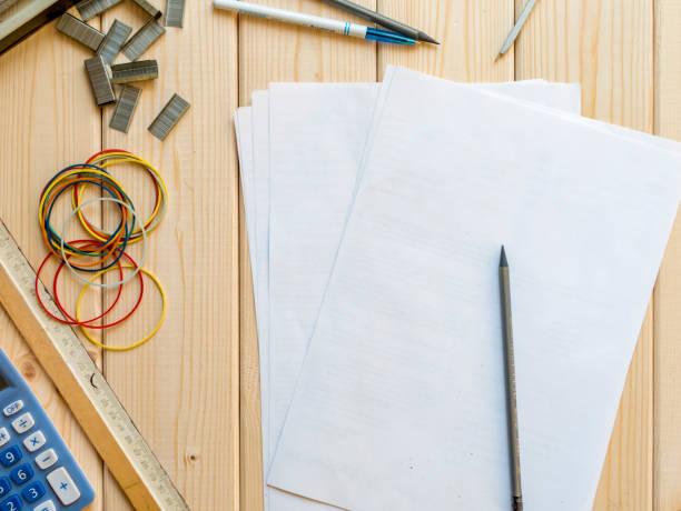 istock top down cute office work place on a wooden surface 955180744