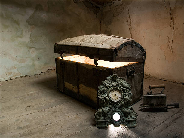 An old-fashioned steamer trunk on a wooden bench evokes nostalgia a
