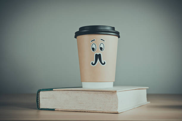 istock Cute cup of coffee and a book 955183522