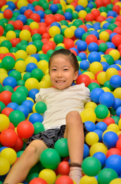 istock Girl's playing with balls 955186238